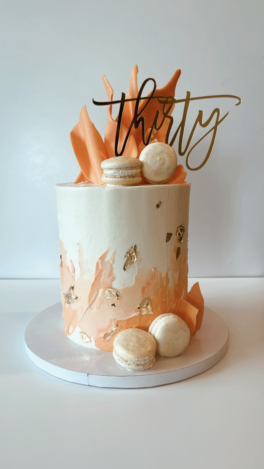 Peach and gold birthday cake with a Thirty topper